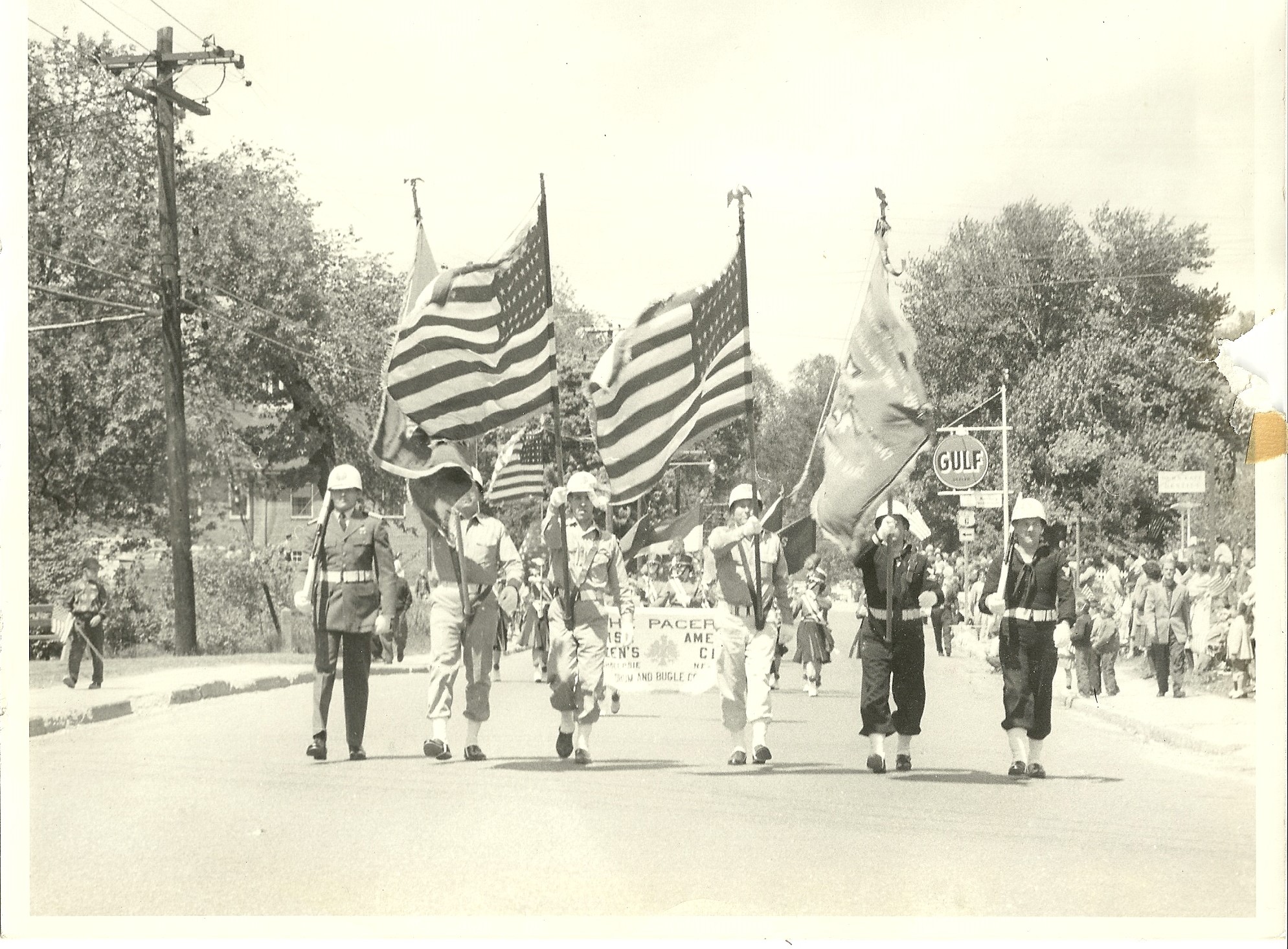 Black & white photo of past Brewster parade. Date unknown.